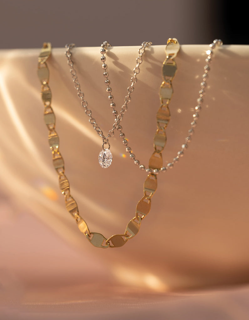 collection of diamond and gold necklaces