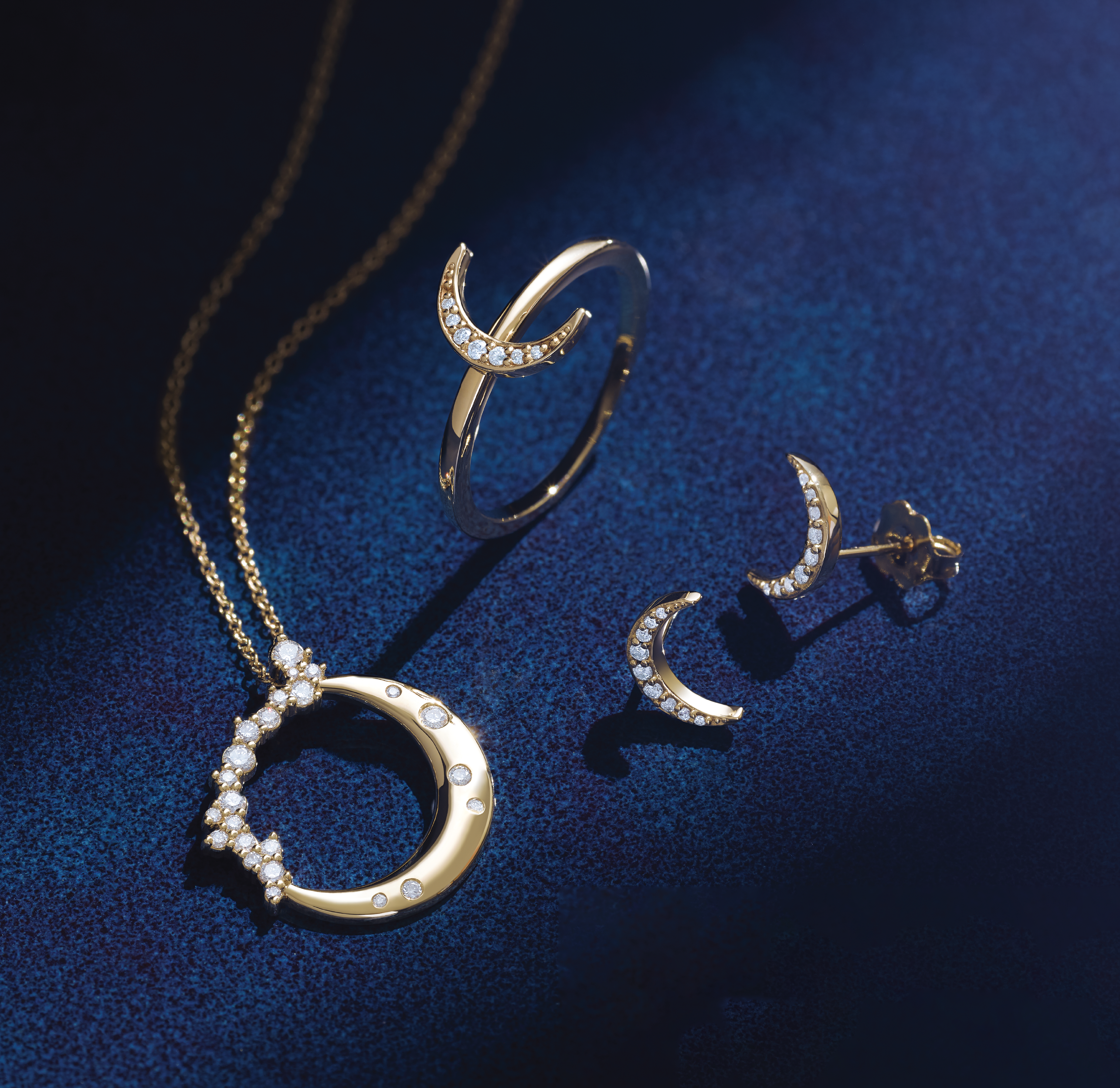 Yellow gold diamond crescent moon necklace with cresent gold ring and earrings