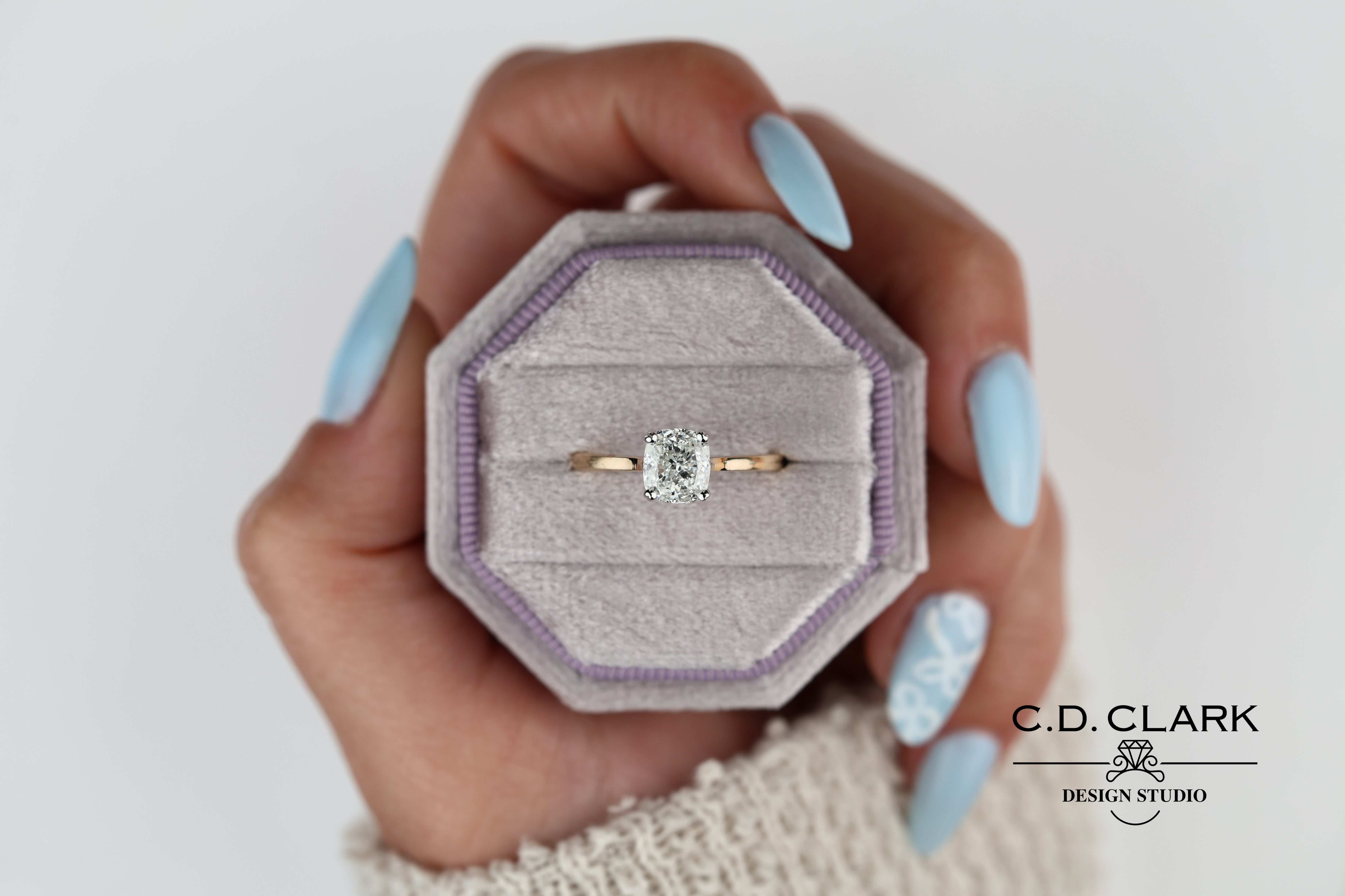 Shimmering brilliance awaits in this stunning 14kt Gold Band, featuring a dazzling 1.55 ct Cushion