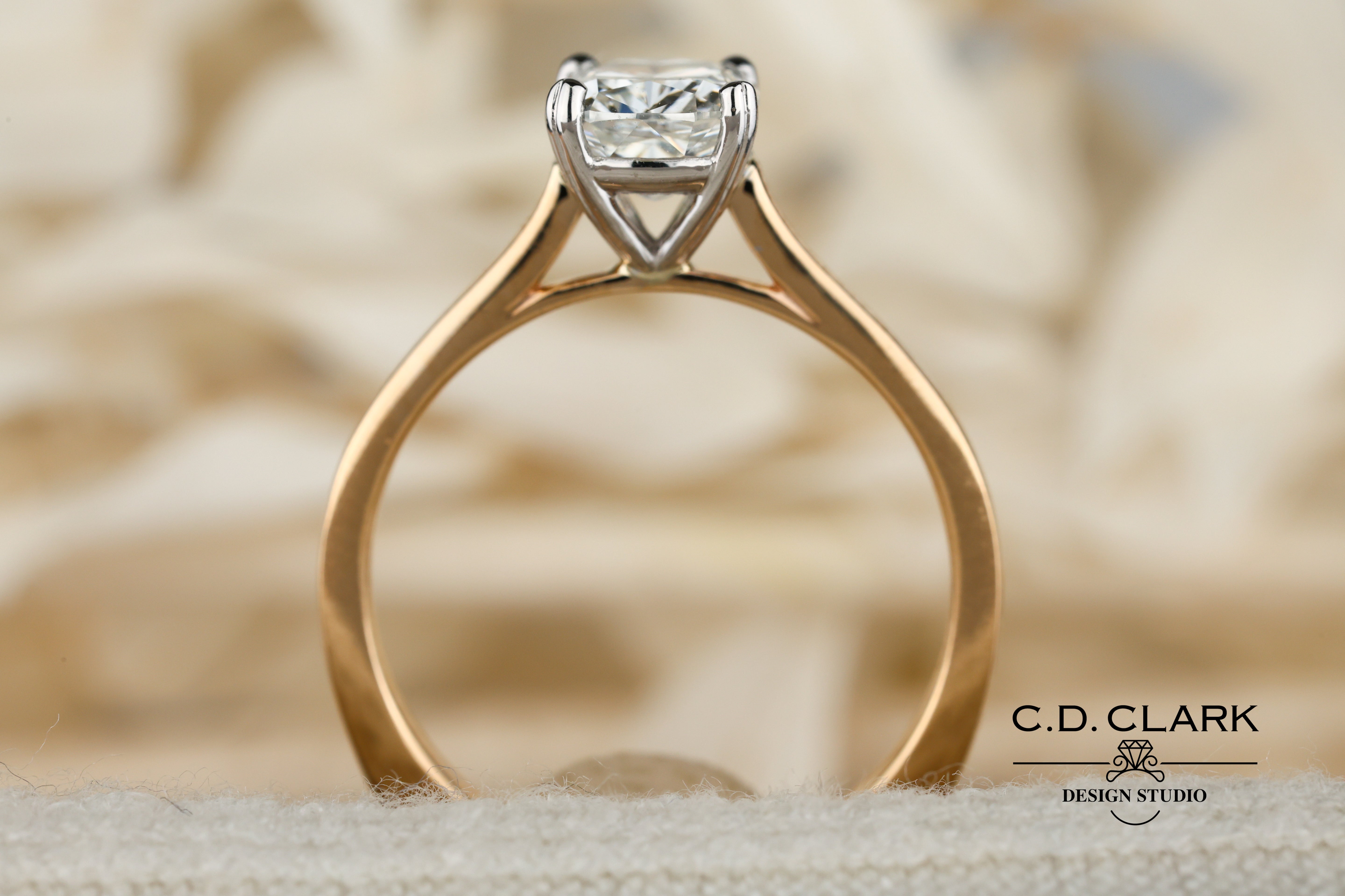 Shimmering brilliance awaits in this stunning 14kt Gold Band, featuring a dazzling 1.55 ct Cushion