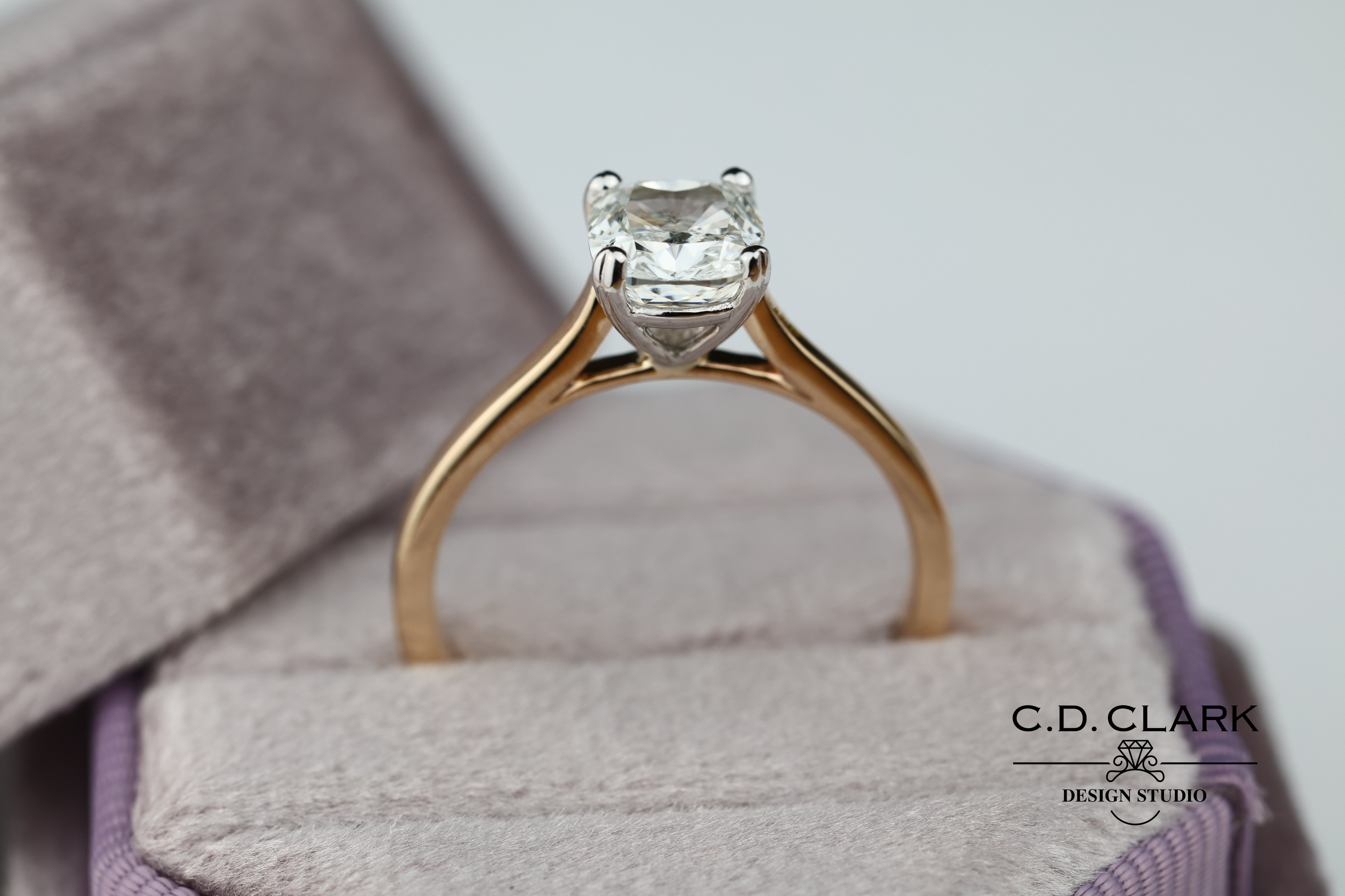 Shimmering brilliance awaits in this stunning 14kt Gold Band, featuring a dazzling 1.55 ct Cushion