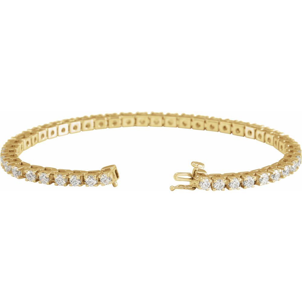 close up of 14K yellow gold line bracelet featuring lab-grown diamonds