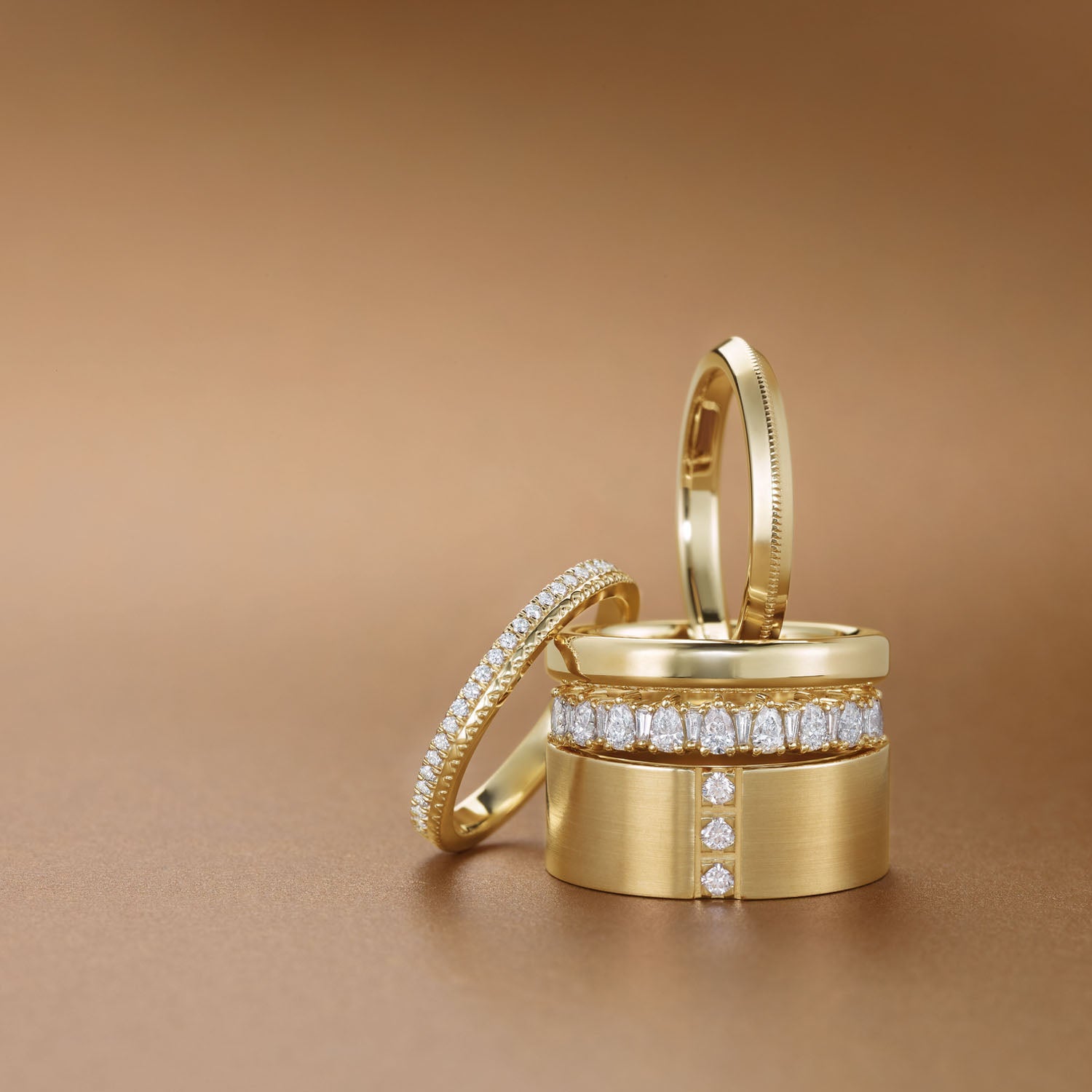 multiple yellow gold and diamond rings