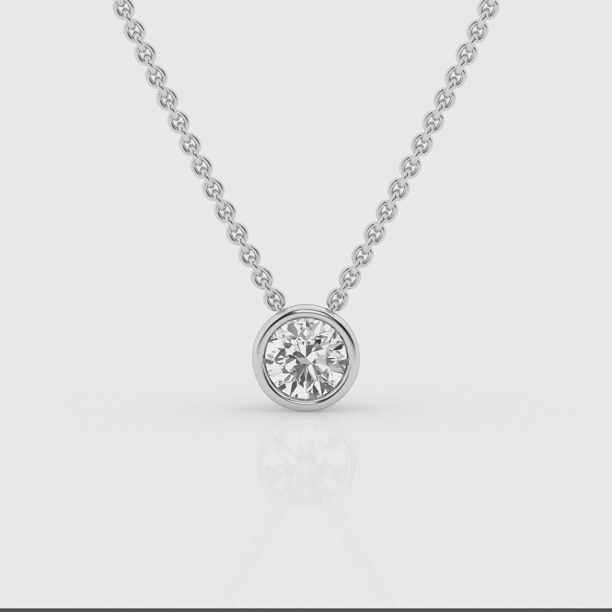 Video of White gold bezel pendant showcasing a 0.5 carat lab-grown diamond