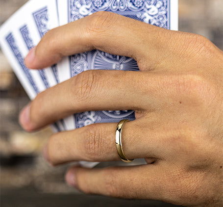 man wearing 18K yellow gold Euro-Dome Comfort Fit wedding band