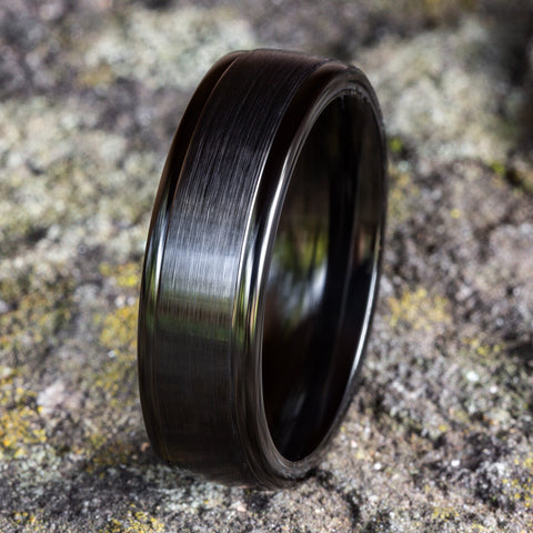 side view of black titanium Satin center, polished round edges wedding band