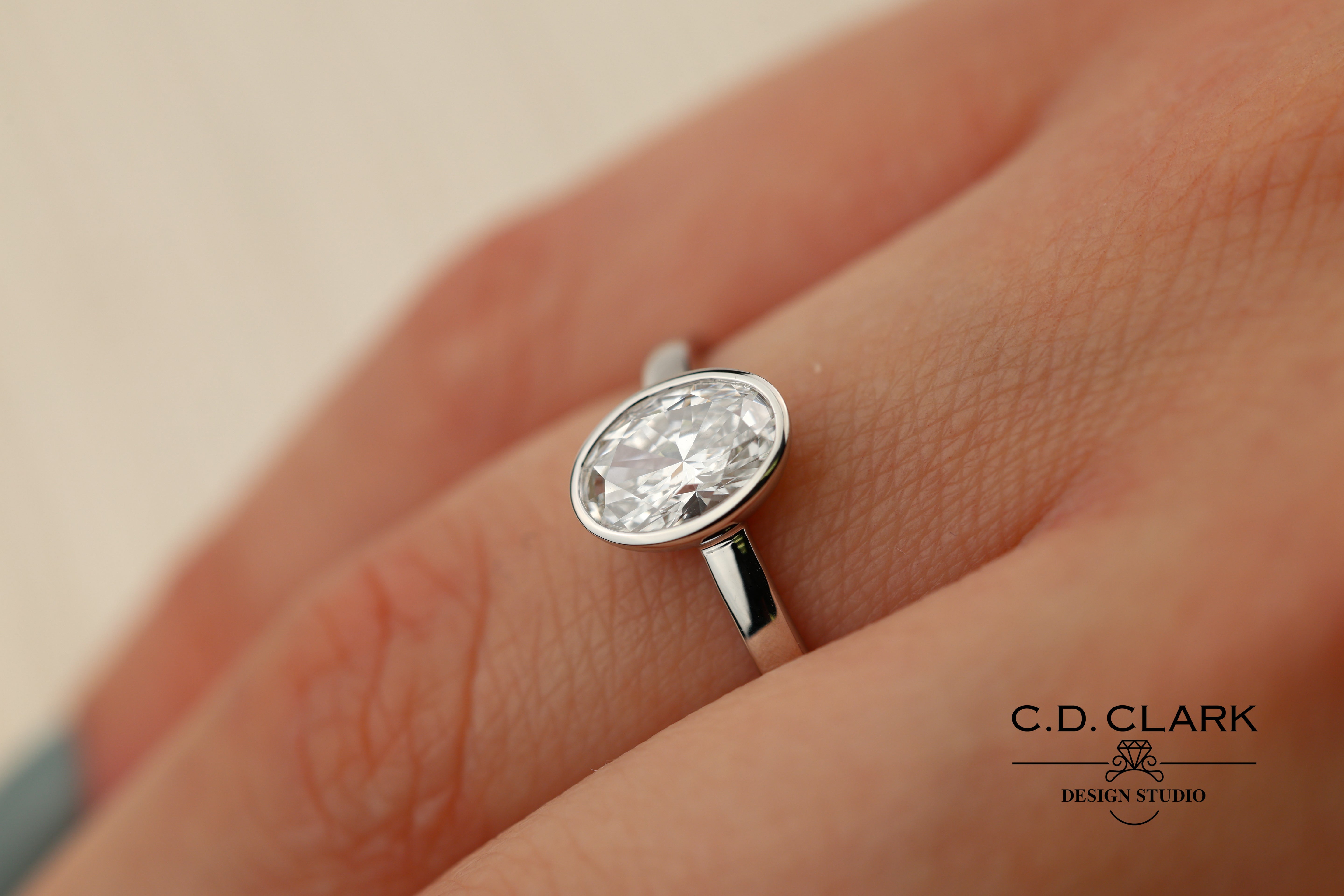 The Aria Oval Diamond White Gold Bezel Set Engagement Ring