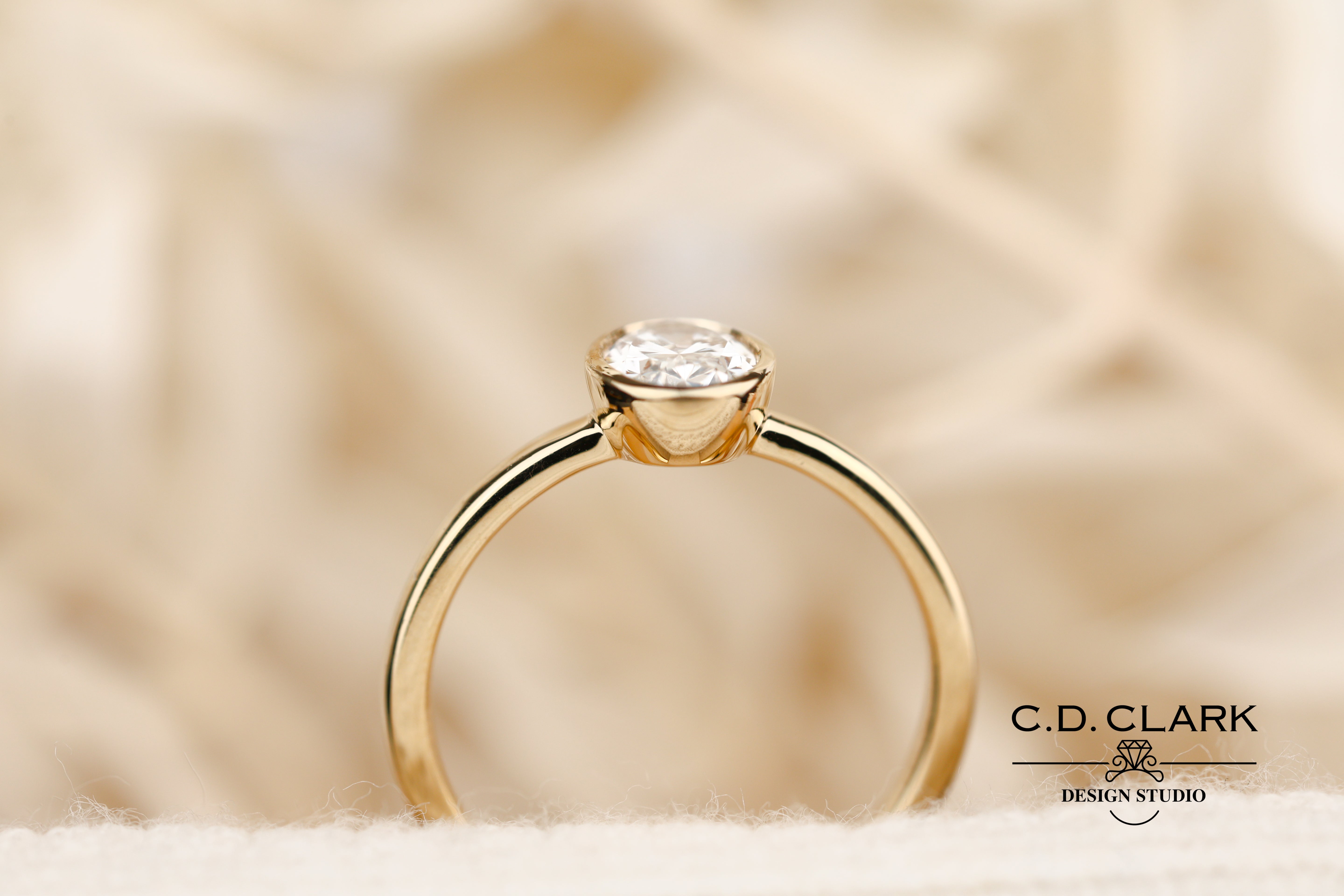 The Aria Oval Yellow Gold Bezel Set Engagement Ring