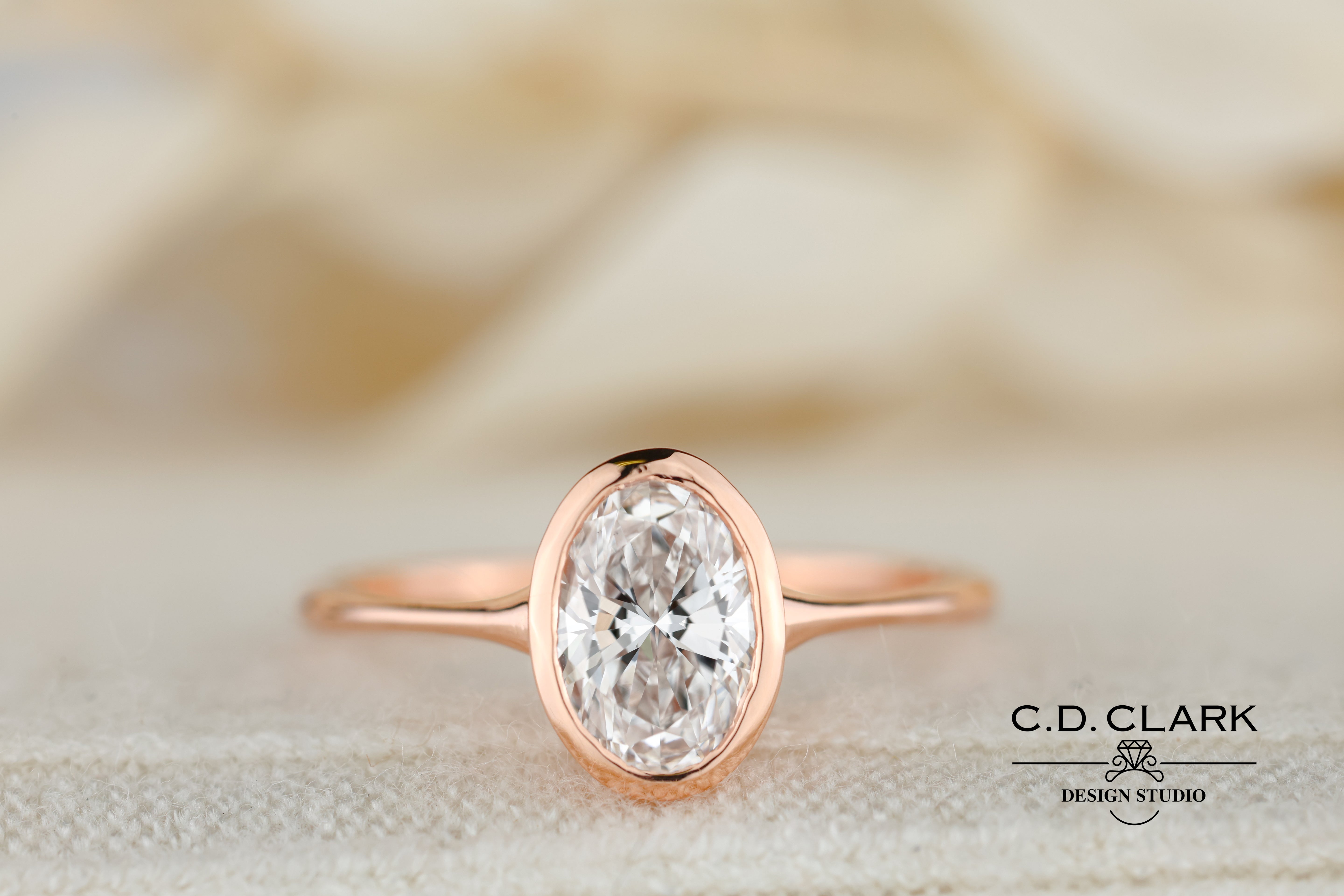 The Aria Oval Rose Gold Bezel Set Engagement Ring