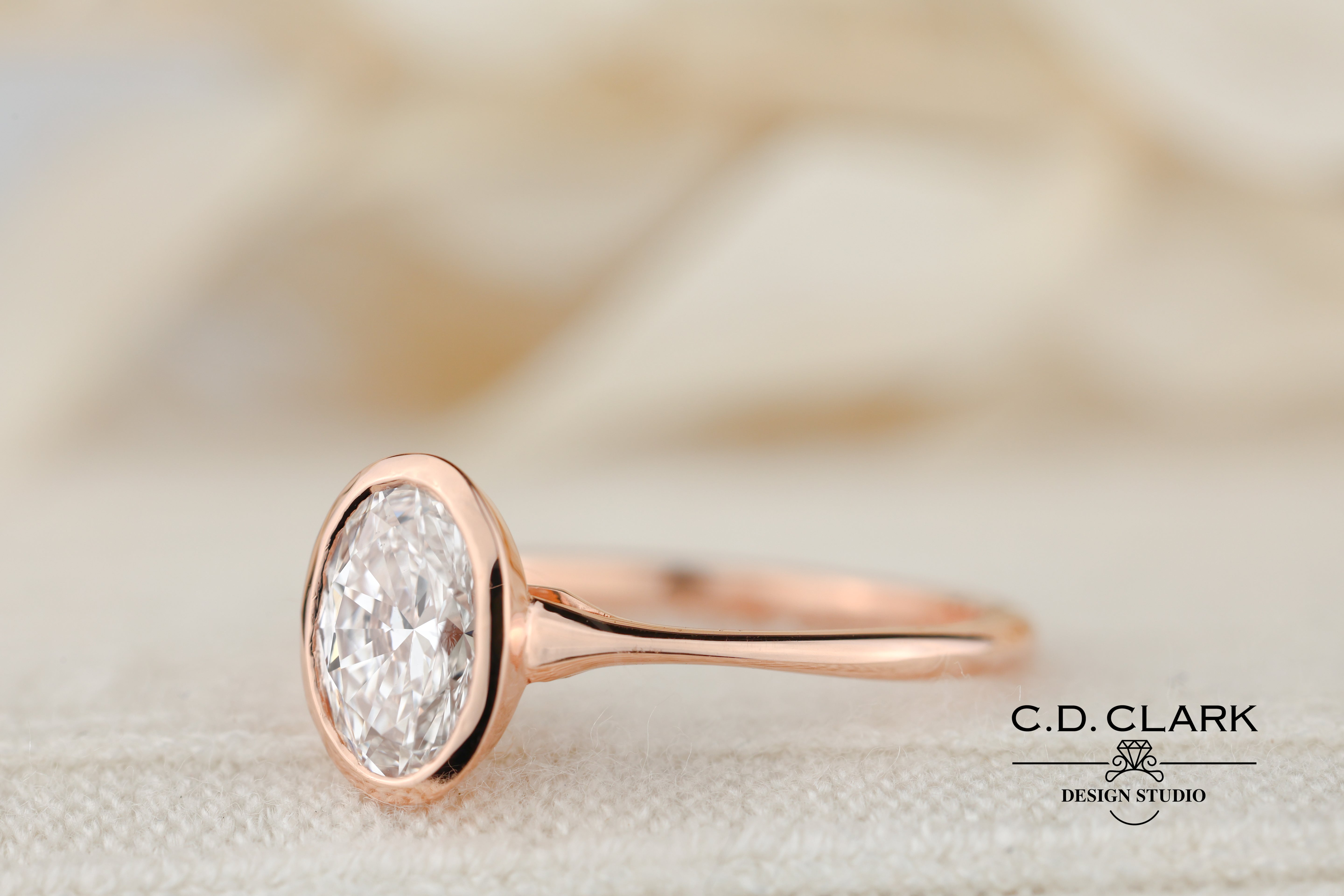 The Aria Oval Rose Gold Bezel Set Engagement Ring