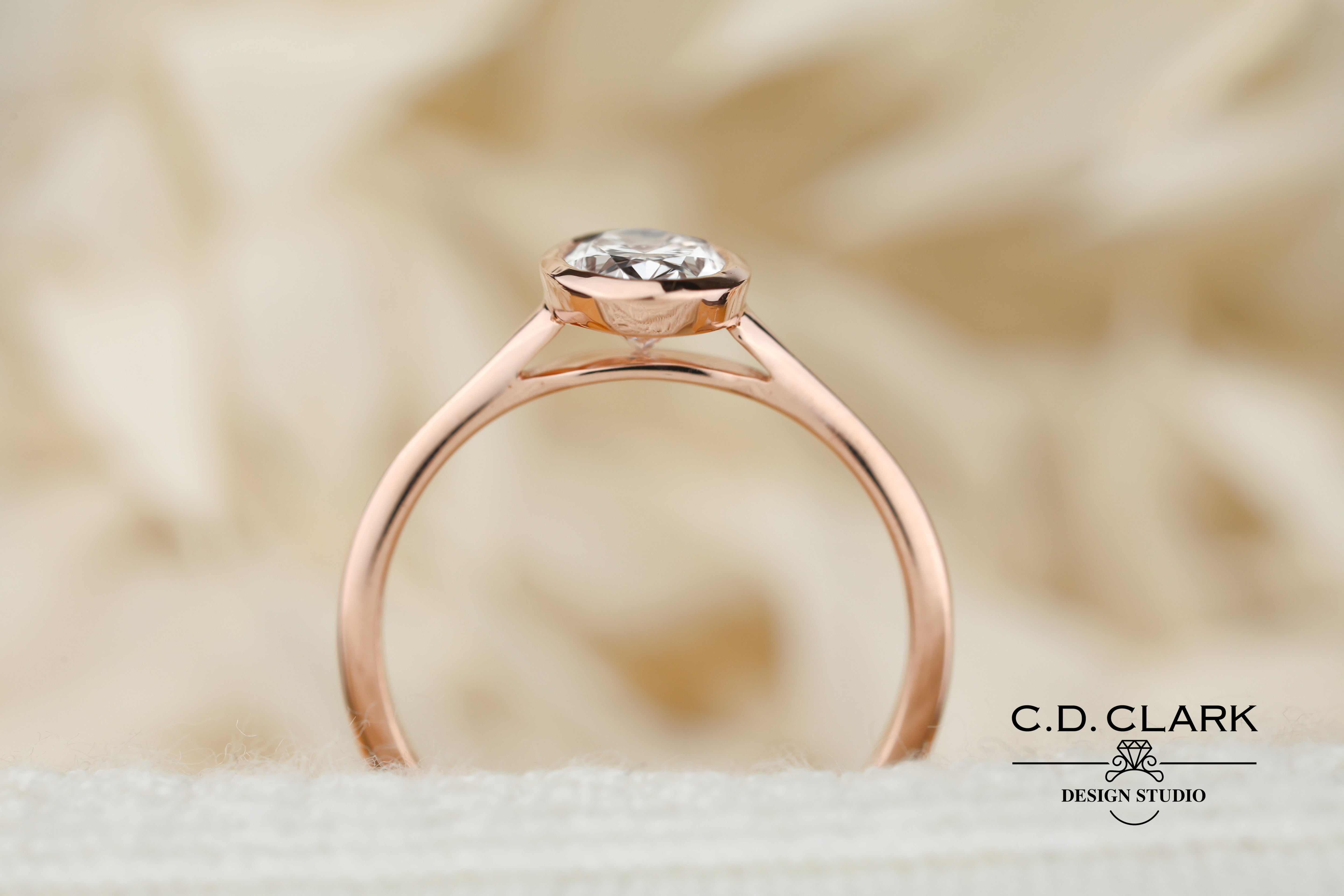 The Aria Oval Rose Gold Bezel Set Engagement Ring